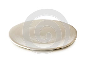 White ceramic plate isolated on a white background.