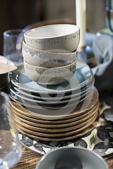 White ceramic plates on a shelf in a store