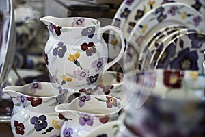 White ceramic plates on a shelf in a store