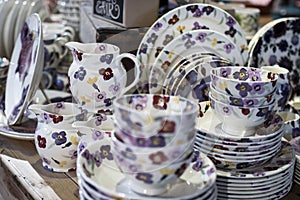 White ceramic plates on a shelf in a store