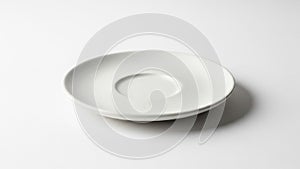 White ceramic saucer displayed against a plain white background