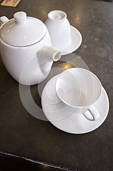 White ceramic tea pot ,cups and saucers