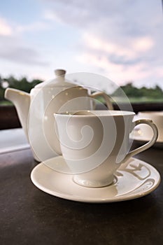 White ceramic tea pot ,cups and saucers