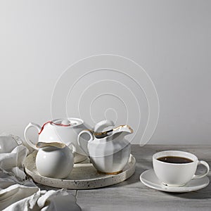 White ceramic tea set on the table