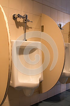 White ceramic urinals in the men`s room