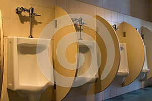 White ceramic urinals in the men`s room