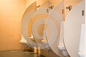 White ceramic urinals in the men`s room