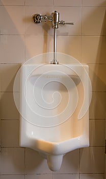 White ceramic urinals in the men`s room