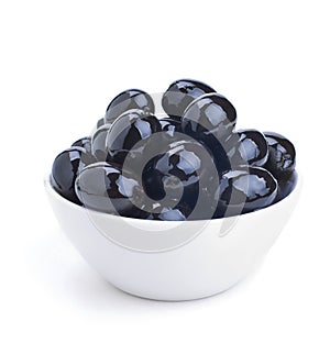 White ceramics bowl with black olives