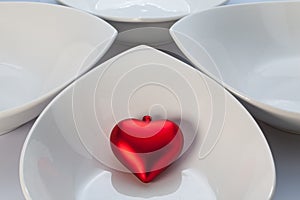 White ceramics bowls and red heart