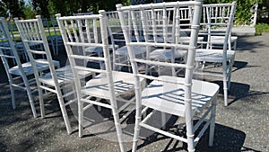 White ceremony chairs. Wedding detail. Before party set