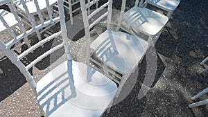 White ceremony chairs. Wedding detail. Before party set