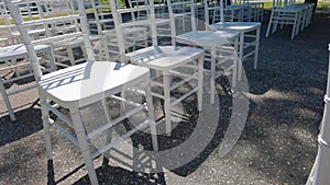 White ceremony chairs. Wedding detail. Before party set