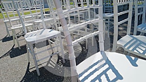 White ceremony chairs. Wedding detail. Before party set