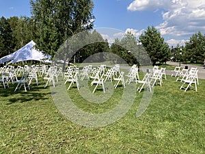 White chairs for the audience at the open air