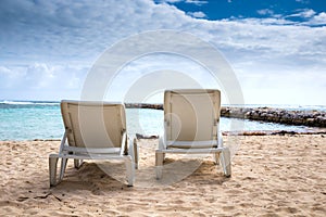 White chairs at beach in Guadeloupe