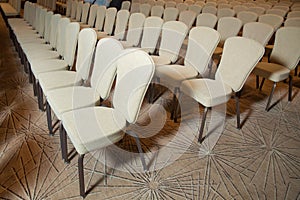 White chairs in the conference room. empty seat in conference meeting hall . White Chairs in the Conference Room just before a