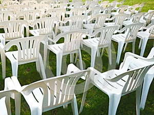 White chairs on green grass