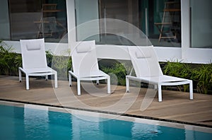 White chairs in the poolside