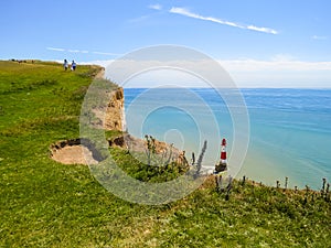 White chalk cliffs and Beachy Head Lighthouse