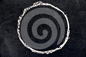 White chalk drawing as circle shape on black board