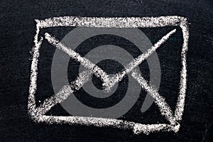 White chalk drawing in mail envelope icon on black board