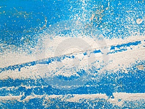 White chalk dust on a blue background photo