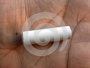 White chalk stick on palm of hand