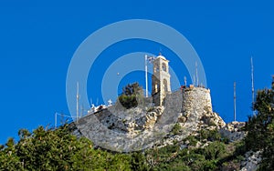 White Chapel of Saint George on Mont Lykabettos with blue sky, Athens