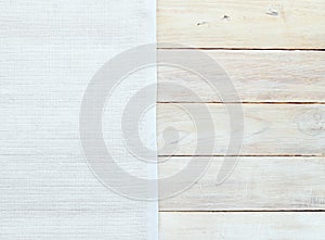 White checkered material and grunge wood board texture background.