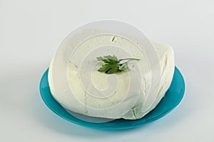 White cheese on a blue azzure plate photo