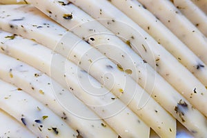 White Cheese with spices and sliced bits close-up