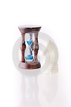 White chess horse with sand-clock