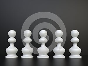 White chess pawns in a line in front of black background