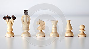 White chess pieces in a row