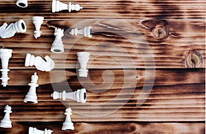 White chess pieces scattered on the table