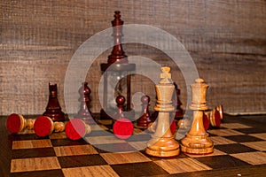 White chess pieces in submission position on the board