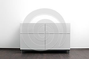 White chest of drawers in bright minimalism interior