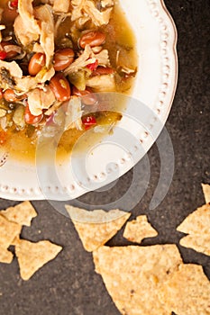 White chicken chili with chips top view