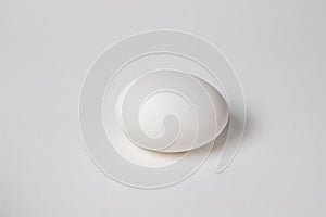 White chicken egg. White egg lies on burlap