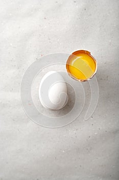 White chicken egg with one egg yolk