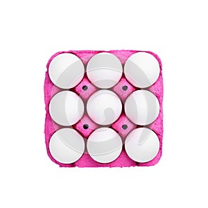 White chicken eggs in a pink carton tray box on isolated white background