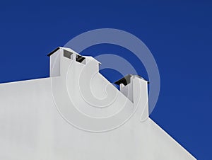 White chimneys and blue sky