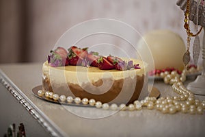 White Chocolate cake with berries with beauty background.