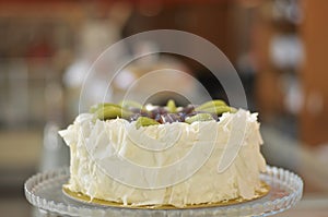 White chocolate cake with fresh fruits with Christmas decoration