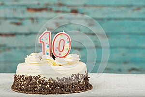 White and chocolate cake with ten candles