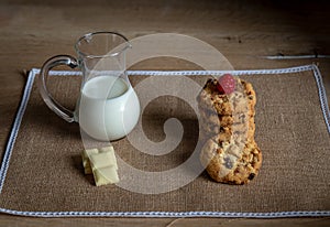 White chocolate cookies and jug of milk delicious traditional