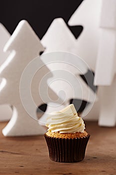 White chocolate cupcake on Christmas background