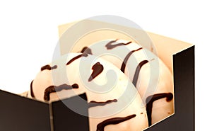 White chocolate glazed ring doughnut with zebra pattern photo