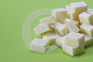 White chocolate in a green background